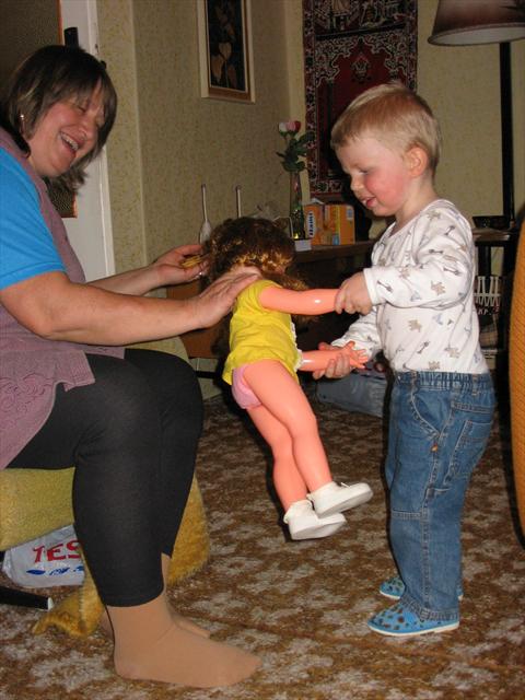 Jája dancing with a doll